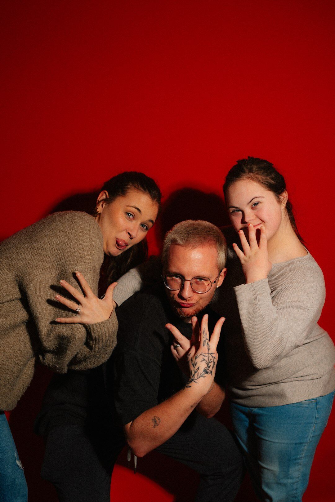 Group of media production specialists posing together in a studio