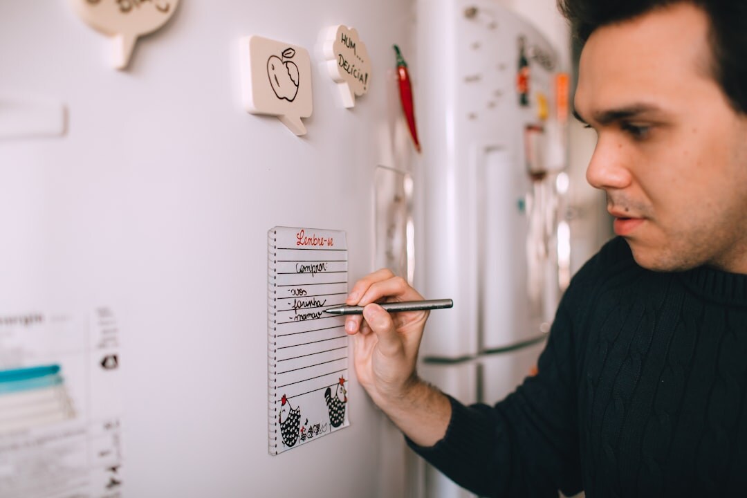 Producer planning a production schedule on a whiteboard