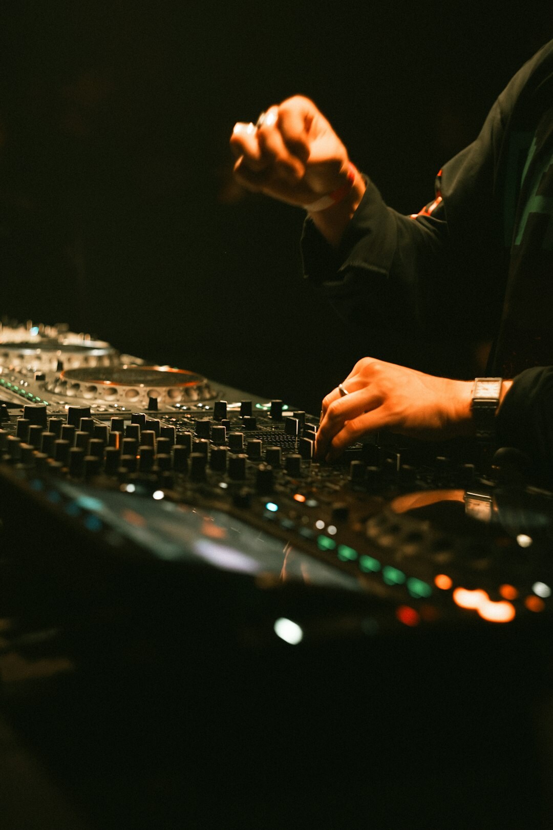 Sound engineer working at an audio mixing console