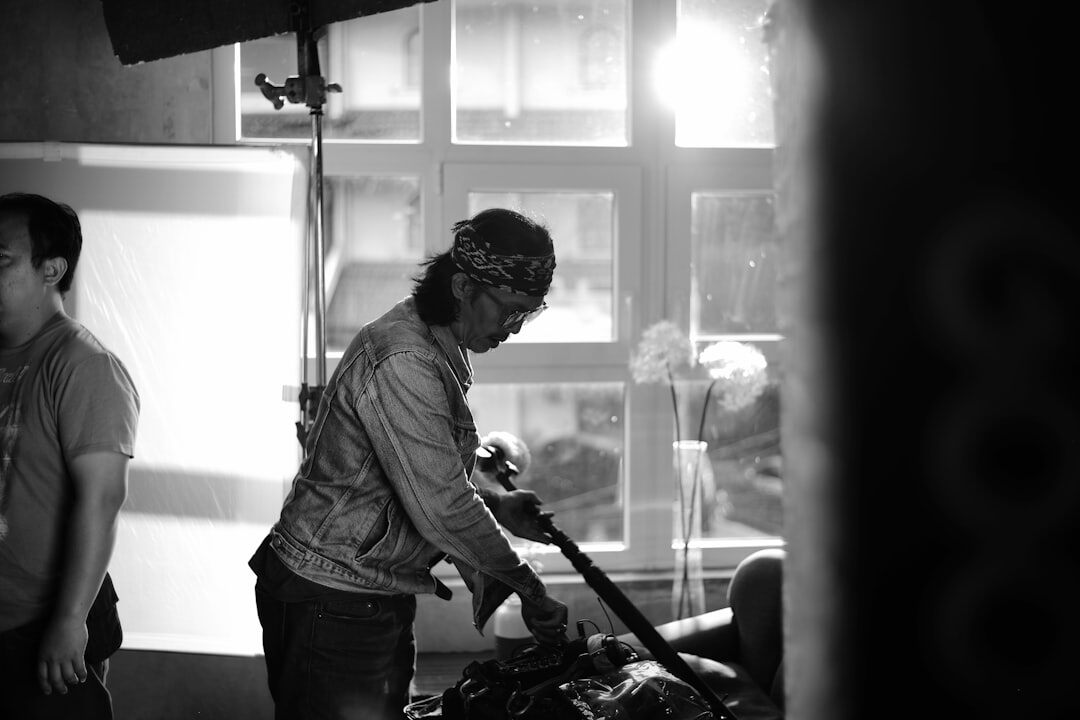 Crew setting up cameras and lights before a studio recording